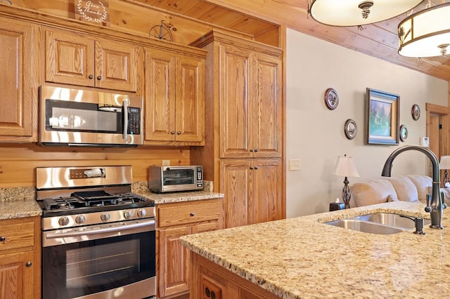 1172 Settlers Ridge Rd, Ellijay, GA 30540 - kitchen with appliances with stainless steel finishes, a sink, wood ceiling, light stone countertops, and brown cabinets