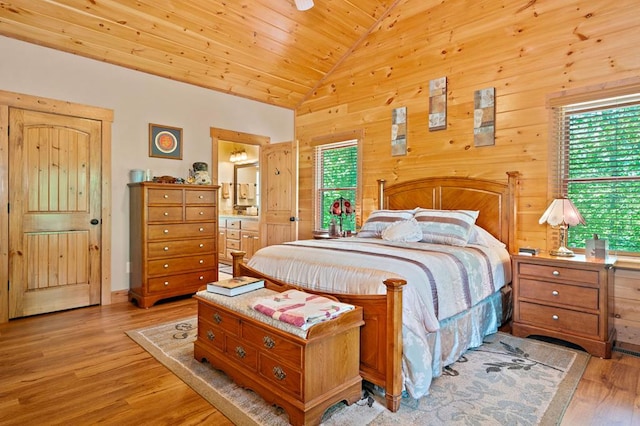 1172 Settlers Ridge Rd, Ellijay, GA 30540 - bedroom with vaulted ceiling, light wood finished floors, wood ceiling, ensuite bath, and wooden walls