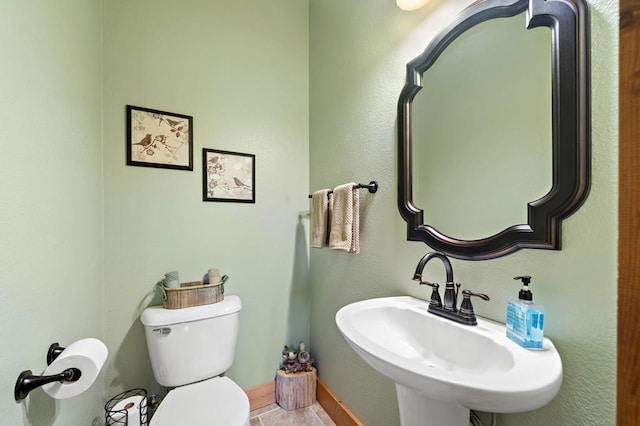 1172 Settlers Ridge Rd, Ellijay, GA 30540 - half bathroom with a sink, toilet, and baseboards