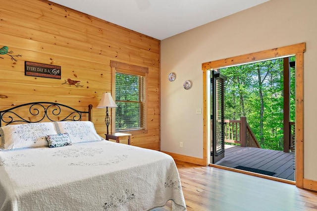 1172 Settlers Ridge Rd, Ellijay, GA 30540 - bedroom with access to outside, wooden walls, baseboards, and wood finished floors