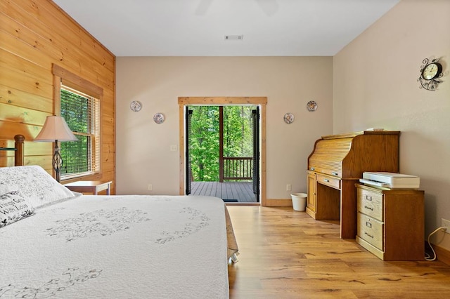 1172 Settlers Ridge Rd, Ellijay, GA 30540 - bedroom with access to exterior, light wood finished floors, wooden walls, and ceiling fan