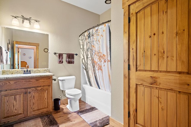 1172 Settlers Ridge Rd, Ellijay, GA 30540 - full bath featuring wood finished floors, vanity, toilet, shower / tub combo, and baseboards
