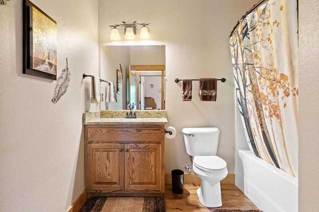 1172 Settlers Ridge Rd, Ellijay, GA 30540 - bathroom with vanity, toilet, wood finished floors, and shower / tub combo