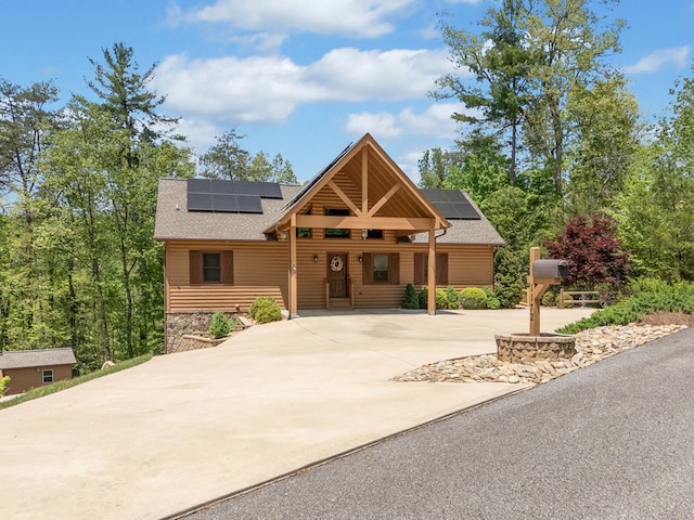 1172 Settlers Ridge Rd, Ellijay, GA 30540 - chalet / cabin featuring solar panels, roof with shingles, driveway, and stone siding