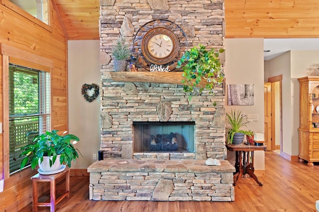 1172 Settlers Ridge Rd, Ellijay, GA 30540 - living area featuring wood finished floors, vaulted ceiling, wood ceiling, baseboards, and a fireplace