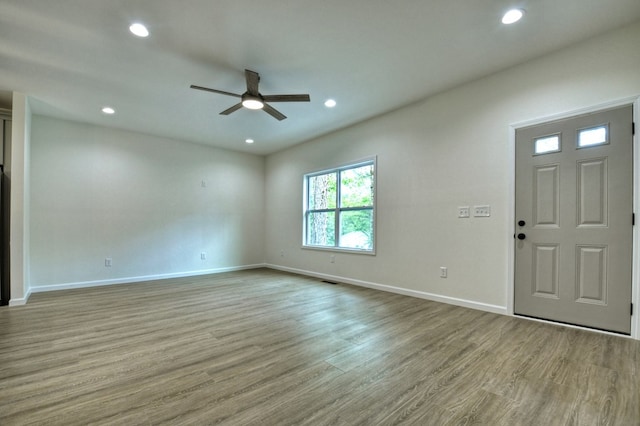 interior space featuring recessed lighting, baseboards, ceiling fan, and wood finished floors