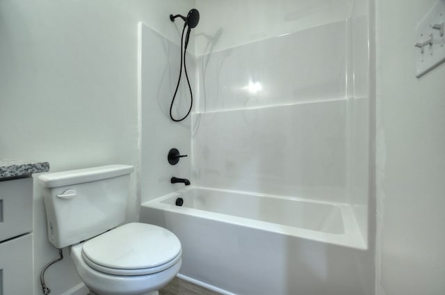 bathroom with toilet and shower / tub combination