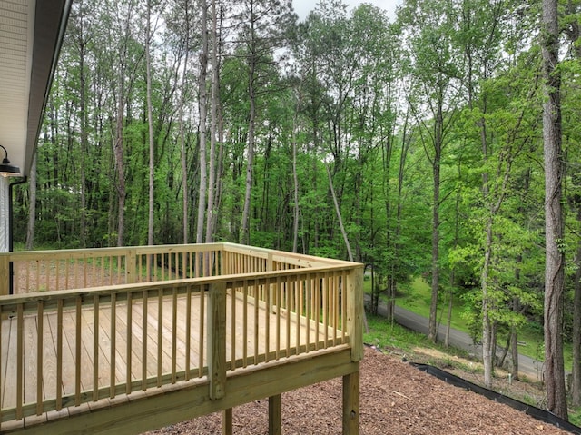 wooden terrace with a forest view