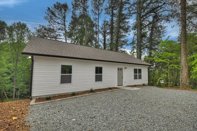view of front of house with roof with shingles