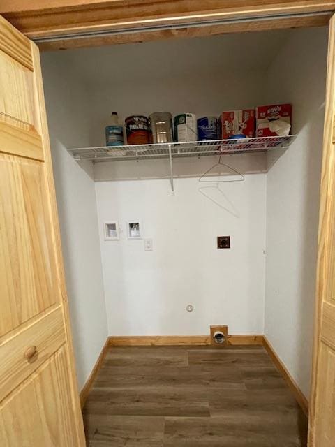 washroom featuring washer hookup, hardwood / wood-style flooring, and hookup for an electric dryer