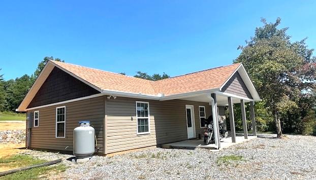 back of house with a patio