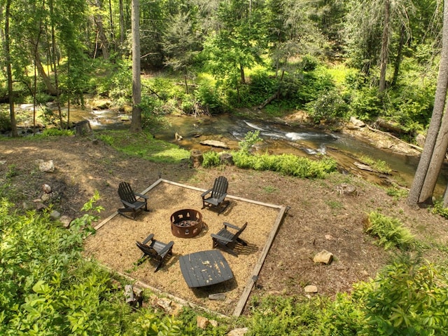 view of yard featuring an outdoor fire pit