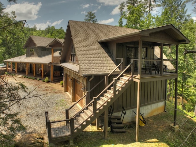 rear view of house with a garage