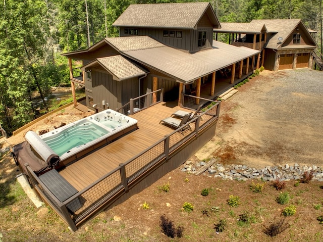 exterior space featuring a garage and a wooden deck