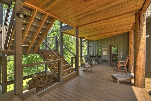 wooden terrace with a grill