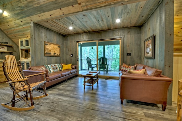 living room with hardwood / wood-style flooring, wooden ceiling, wooden walls, and beamed ceiling