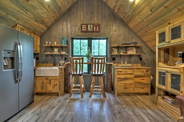 interior space featuring wood ceiling, sink, stainless steel fridge, and hardwood / wood-style floors