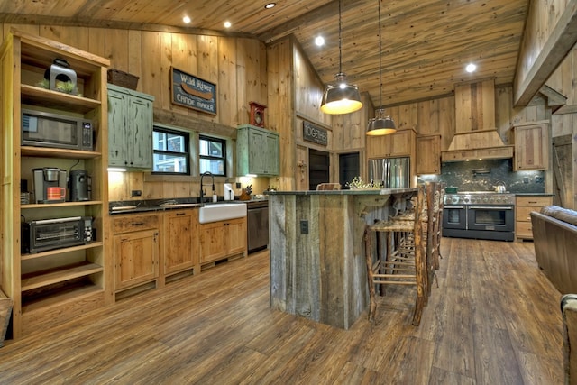 kitchen with stainless steel refrigerator, premium range hood, a kitchen island, wooden ceiling, and range with two ovens