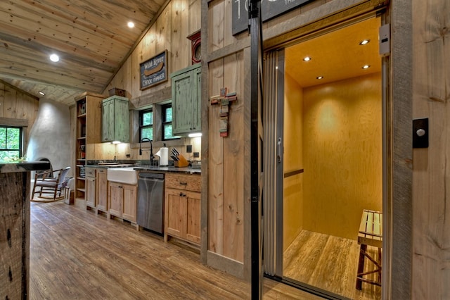 kitchen with hardwood / wood-style flooring, dishwasher, a healthy amount of sunlight, and elevator