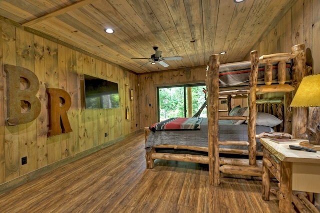 bedroom featuring wood-type flooring, wooden ceiling, and wood walls