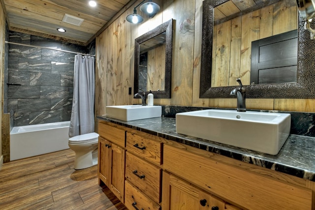 full bathroom with vanity, wood-type flooring, wooden ceiling, toilet, and shower / bath combo with shower curtain