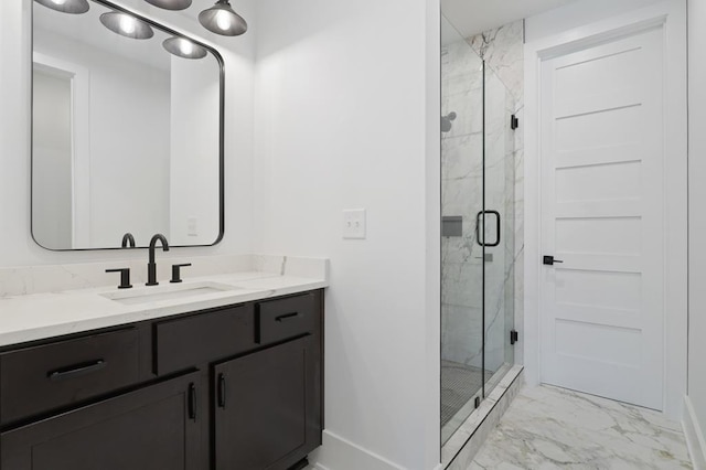 bathroom with a shower with door and vanity