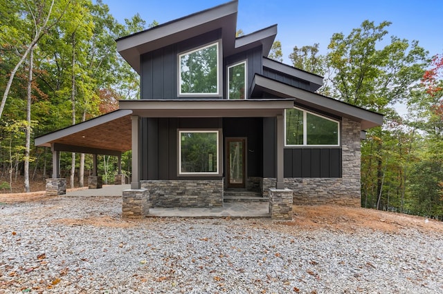 contemporary house featuring covered porch