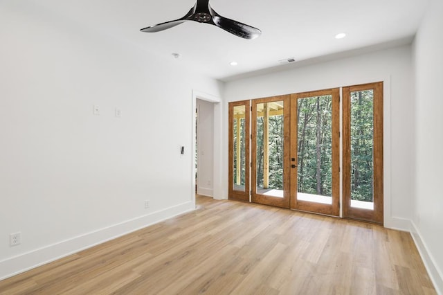 interior space featuring ceiling fan, french doors, and light hardwood / wood-style flooring