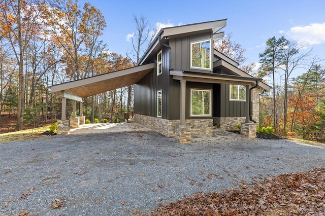 view of property exterior with a carport