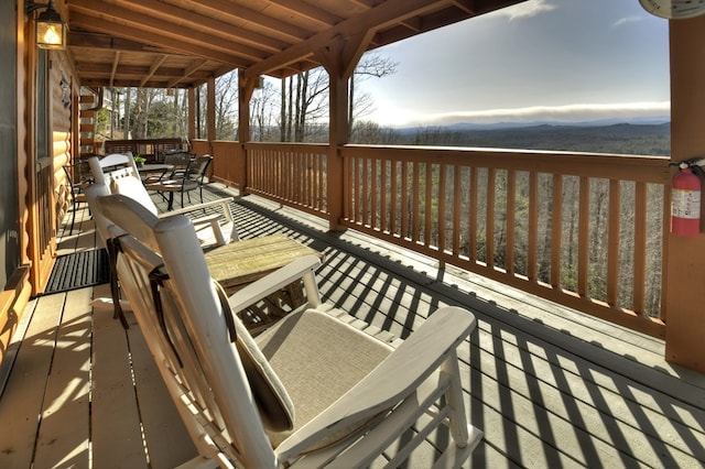 wooden deck featuring a mountain view