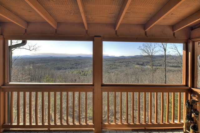 deck with a mountain view and a forest view