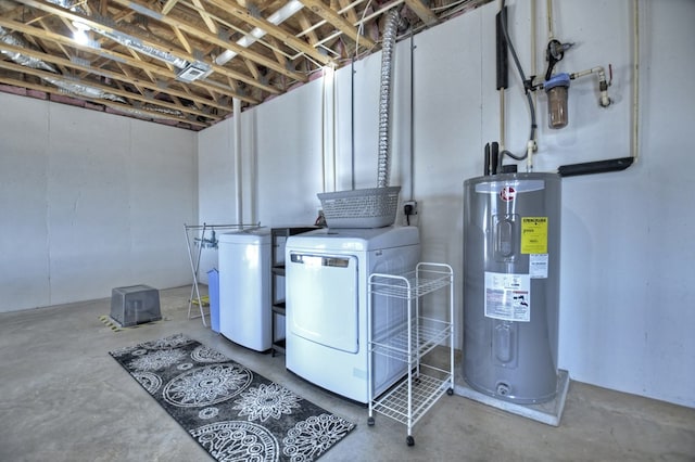 clothes washing area featuring water heater, laundry area, and independent washer and dryer