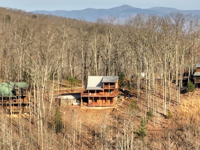 bird's eye view featuring a mountain view and a view of trees