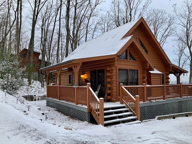 view of front of house with log siding