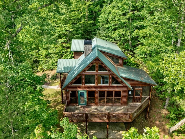 2429 Bullen Gap Rd, Blue Ridge, GA 30513 - rear view of property featuring a chimney, a wooded view, log veneer siding, metal roof, and a wooden deck