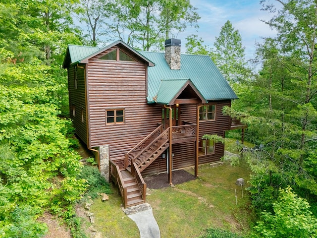2429 Bullen Gap Rd, Blue Ridge, GA 30513 - back of property with faux log siding, a chimney, stairs, metal roof, and a deck