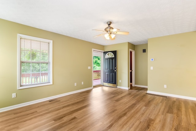 421 Burgess Rd, Ellijay, GA 30540 - entrance foyer featuring healthy amount of natural light, light wood-type flooring, ceiling fan, and baseboards