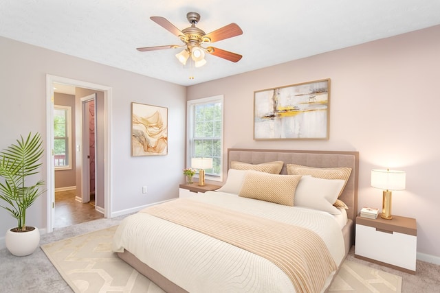 421 Burgess Rd, Ellijay, GA 30540 - bedroom with light colored carpet, baseboards, and a ceiling fan