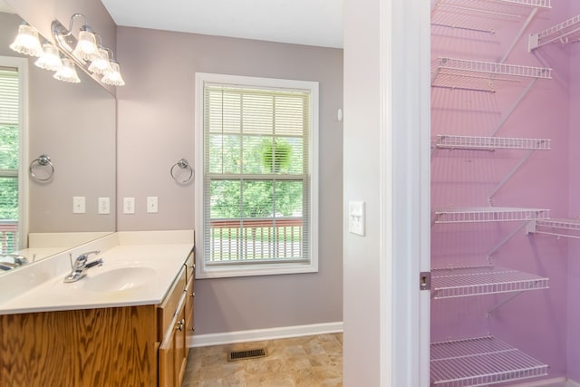 421 Burgess Rd, Ellijay, GA 30540 - bathroom featuring plenty of natural light, vanity, and baseboards