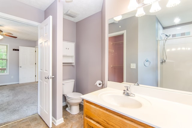 421 Burgess Rd, Ellijay, GA 30540 - bathroom with toilet, vanity, a shower, ceiling fan, and baseboards