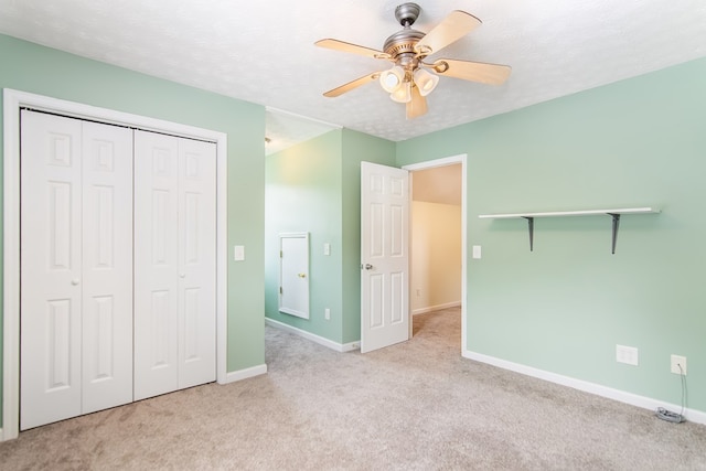 421 Burgess Rd, Ellijay, GA 30540 - unfurnished bedroom featuring carpet, baseboards, a closet, ceiling fan, and a textured ceiling