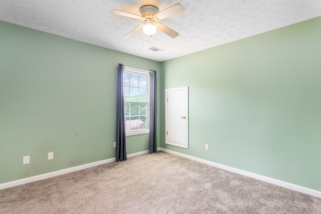421 Burgess Rd, Ellijay, GA 30540 - empty room featuring a textured ceiling, carpet floors, a ceiling fan, and baseboards