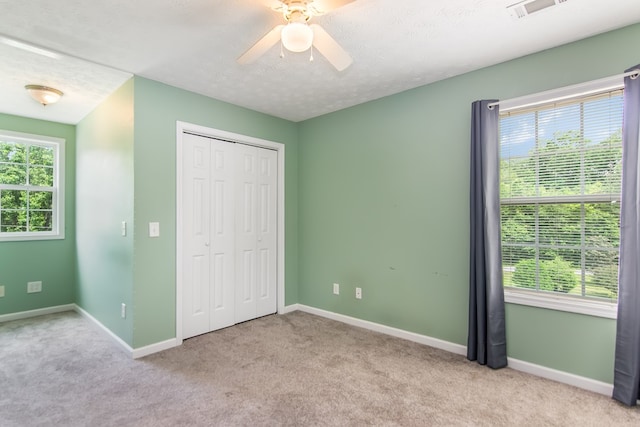 421 Burgess Rd, Ellijay, GA 30540 - unfurnished bedroom featuring carpet flooring, baseboards, a closet, and a ceiling fan