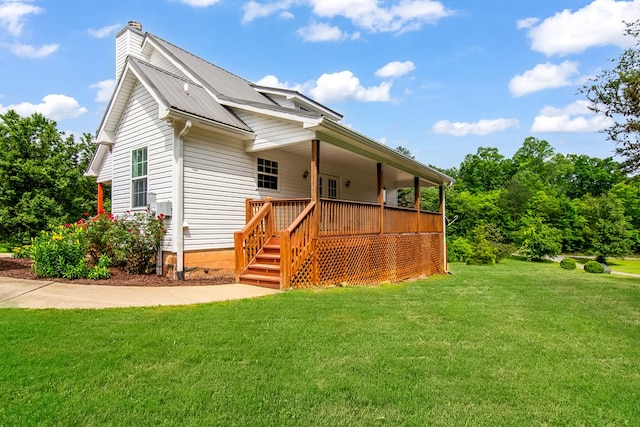 421 Burgess Rd, Ellijay, GA 30540 - rear view of property with a lawn, a chimney, metal roof, and covered porch