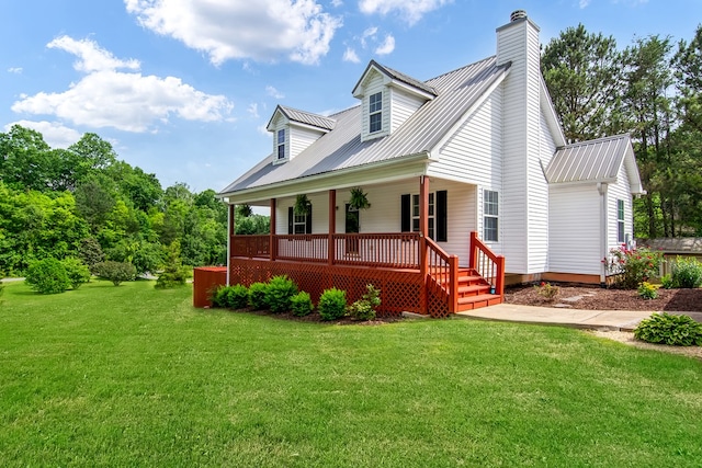421 Burgess Rd, Ellijay, GA 30540 - view of front of home with a porch, a front yard, metal roof, and a chimney