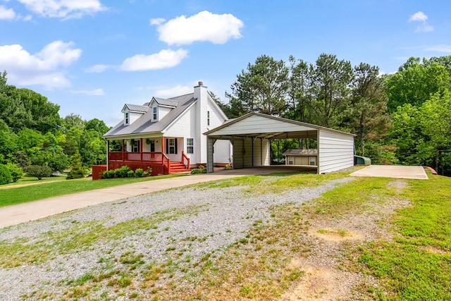 421 Burgess Rd, Ellijay, GA 30540 - view of front of home featuring driveway, a porch, a front lawn, and a chimney