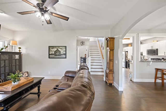 429 Sneaking Creek Dr, Hayesville, NC 28904 - living room featuring arched walkways, a ceiling fan, dark wood finished floors, ornate columns, and baseboards