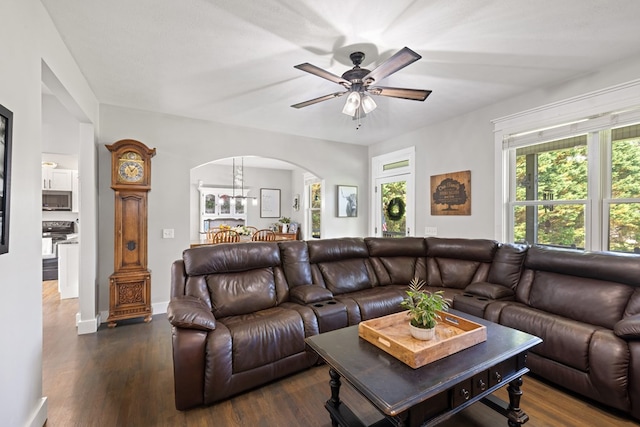 429 Sneaking Creek Dr, Hayesville, NC 28904 - living area with arched walkways, ceiling fan, dark wood-type flooring, and baseboards