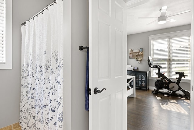 429 Sneaking Creek Dr, Hayesville, NC 28904 - bathroom with curtained shower, ceiling fan, and wood finished floors