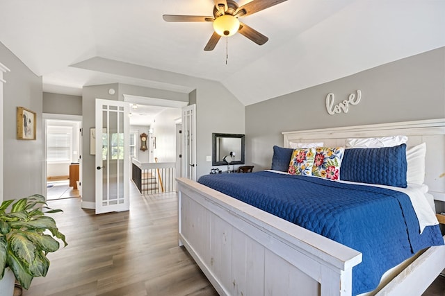 429 Sneaking Creek Dr, Hayesville, NC 28904 - bedroom with wood finished floors, a ceiling fan, vaulted ceiling, and baseboards